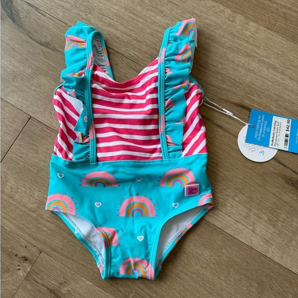 Ruffle Butts Rainbow Swimming Suit.  Girls size 6-12 months. New with tags!